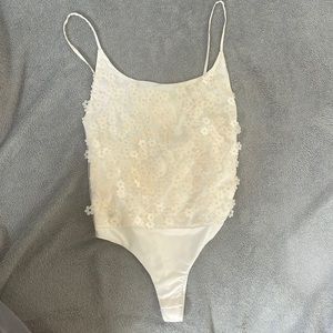 Cream floral sequin body suit from Zara. Has minor stains. Offers are available.